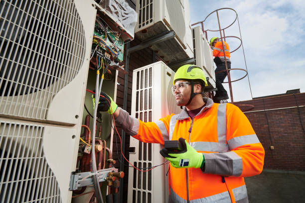 maintenance engineers servicing air conditioning units